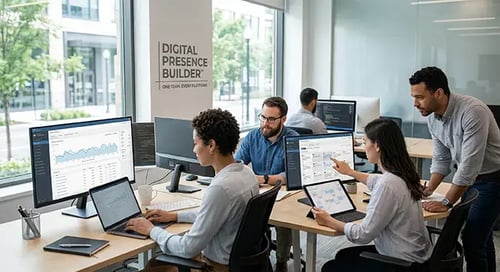 A group of professionals in a modern office setting, collaboratively working on digital content